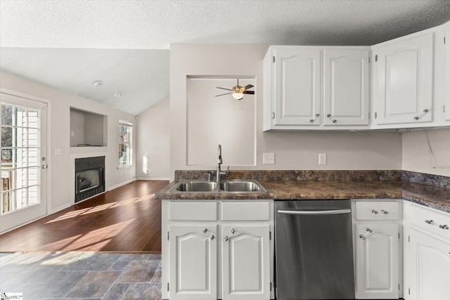 kitchen with white cabinetry, sink, and stainless steel dishwasher