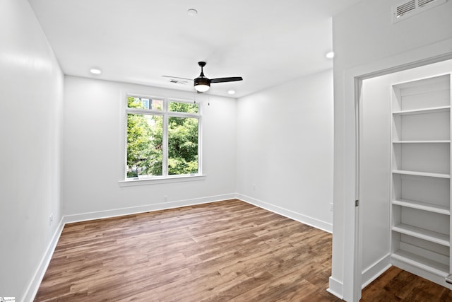 spare room featuring ceiling fan and hardwood / wood-style floors