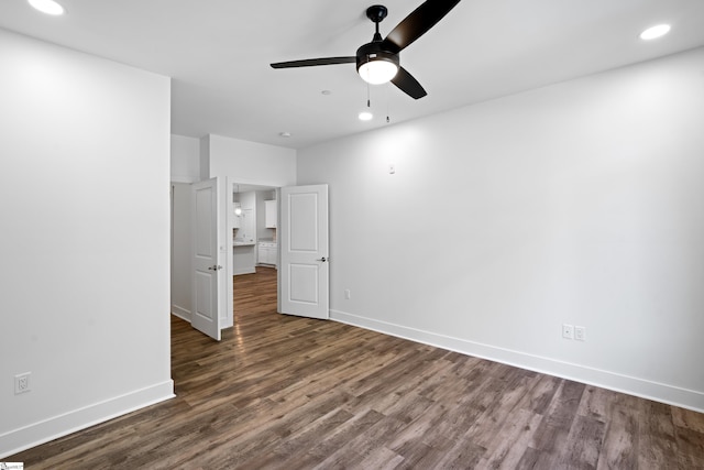 unfurnished bedroom with dark wood-type flooring and ceiling fan