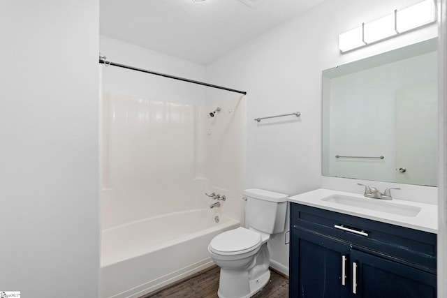 full bathroom featuring wood-type flooring, toilet, shower / bath combination, and vanity