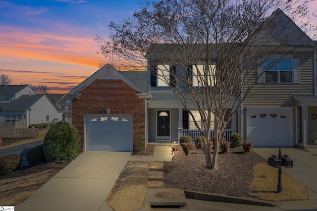 view of front of home featuring a garage and a porch