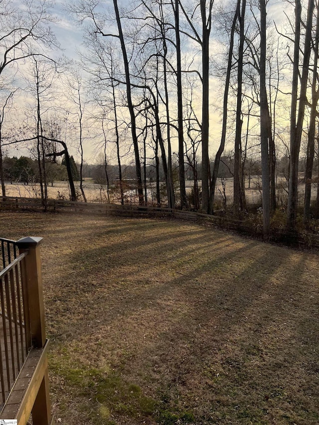 view of yard at dusk