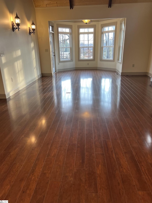 empty room with dark wood-type flooring