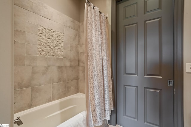 bathroom featuring shower / bathtub combination with curtain