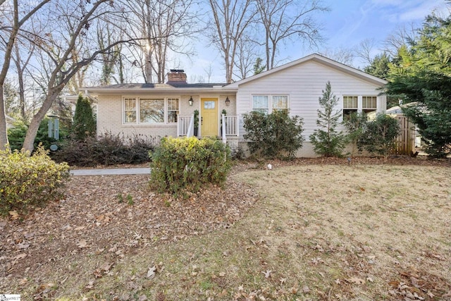 ranch-style home with a front yard