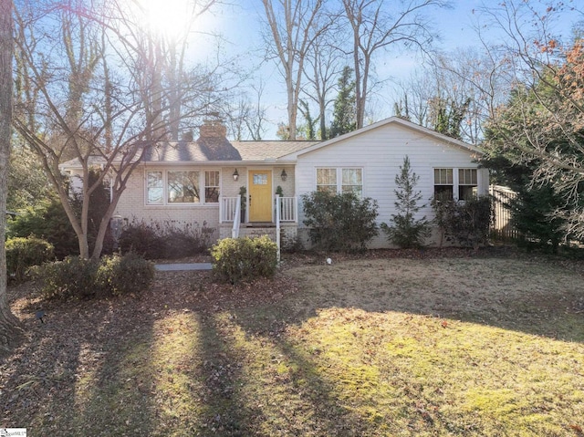 ranch-style house with a front lawn