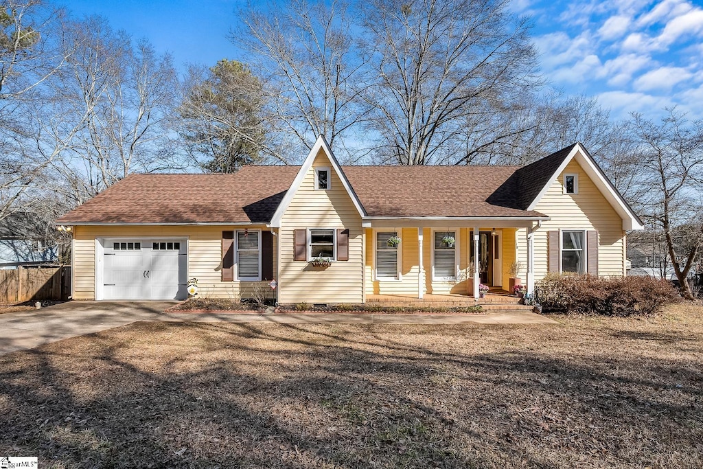 view of front facade featuring a garage and covered porch