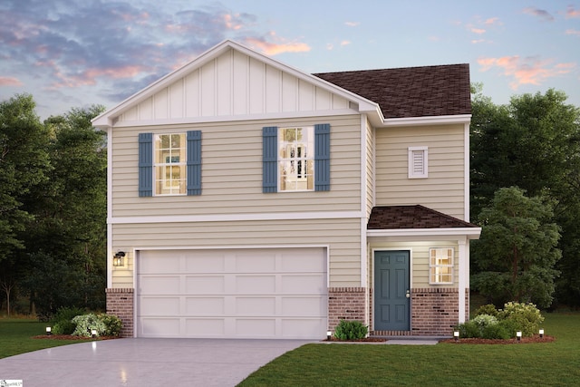 view of front facade with a garage and a lawn