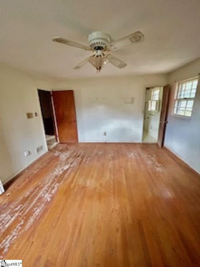 interior space with light hardwood / wood-style floors and ceiling fan