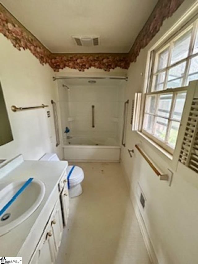 full bathroom featuring vanity, shower / tub combination, and toilet