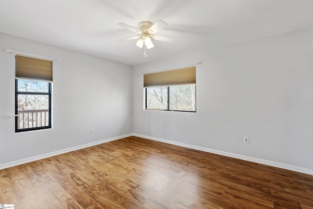 spare room with wood-type flooring and ceiling fan