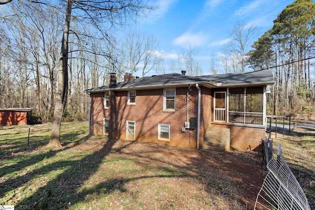 rear view of house with a sunroom