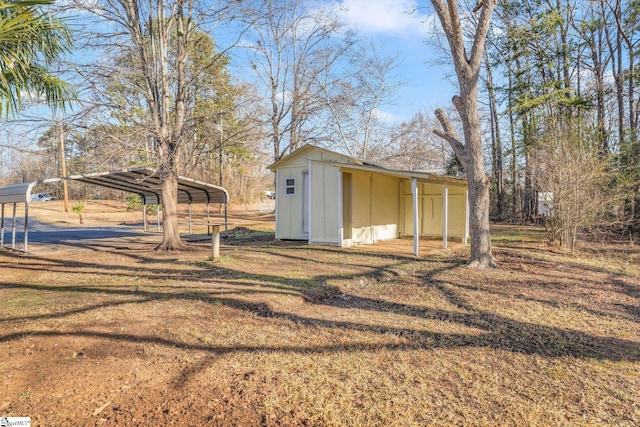 view of outbuilding with a carport