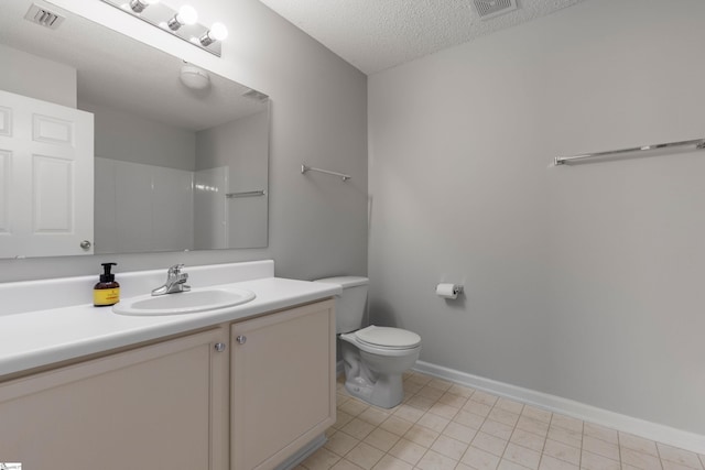 bathroom with vanity, walk in shower, toilet, tile patterned floors, and a textured ceiling