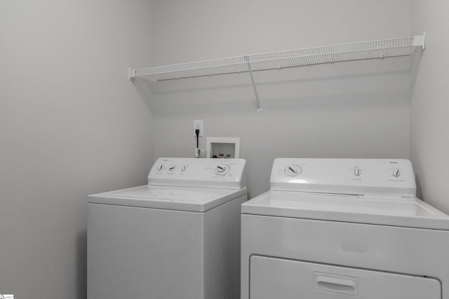 laundry room with separate washer and dryer