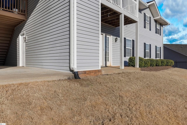 view of home's exterior featuring a lawn