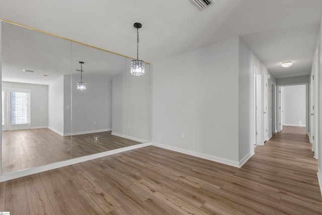 unfurnished dining area with hardwood / wood-style flooring