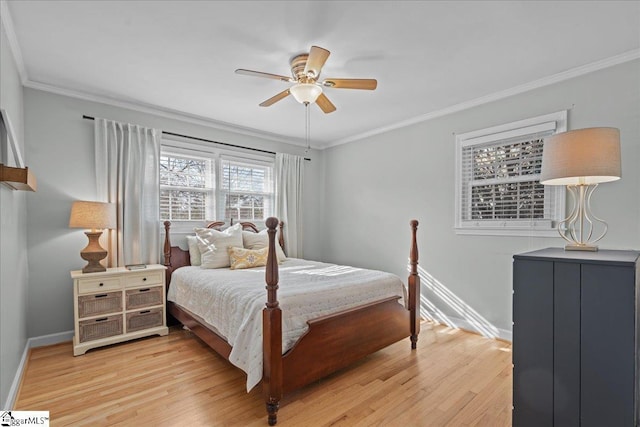 bedroom with ornamental molding, ceiling fan, and light wood-type flooring