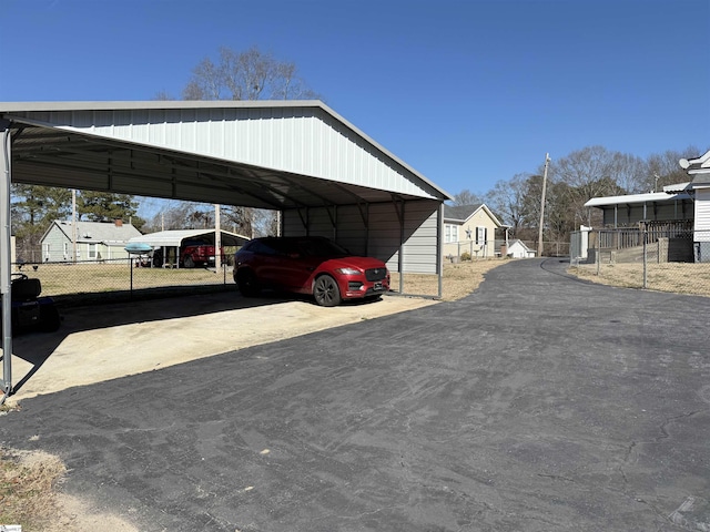 view of vehicle parking with a carport