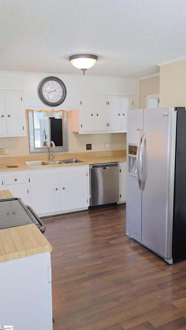 kitchen featuring white cabinetry, appliances with stainless steel finishes, dark hardwood / wood-style flooring, and sink