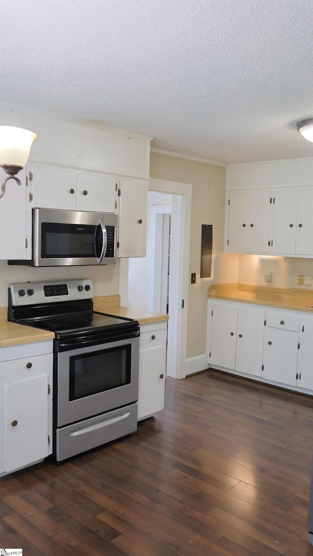 kitchen with dark hardwood / wood-style flooring, a textured ceiling, stainless steel appliances, and white cabinets