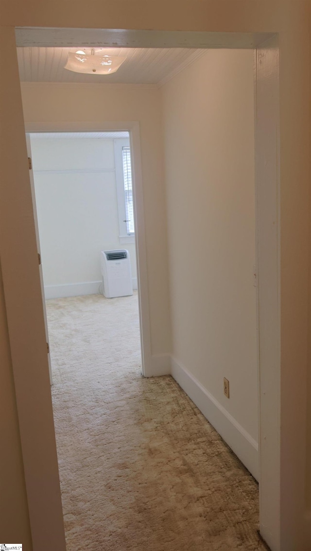 hallway featuring light colored carpet