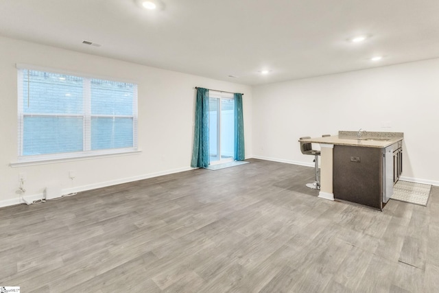 interior space with sink and light wood-type flooring