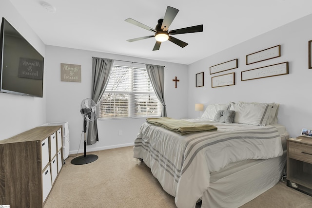 bedroom with light carpet and ceiling fan