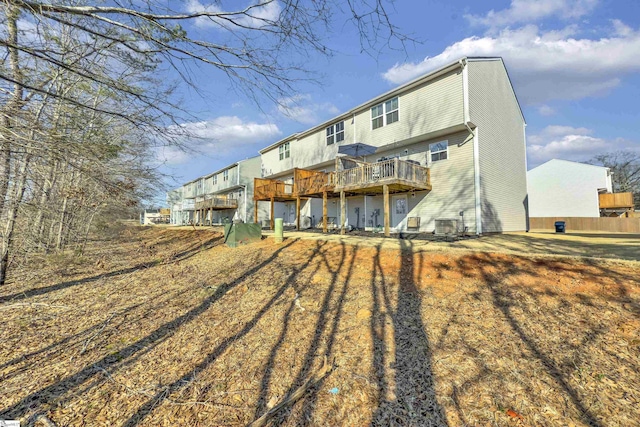 rear view of property with a wooden deck