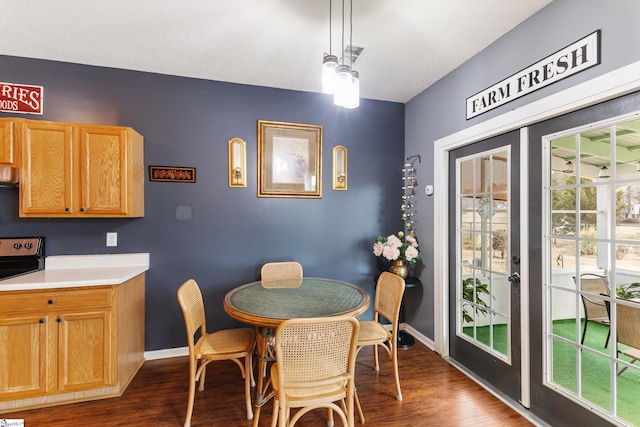 dining room with dark hardwood / wood-style flooring