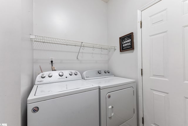 washroom with separate washer and dryer