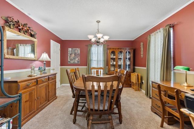 carpeted dining space with a notable chandelier, crown molding, and a textured ceiling