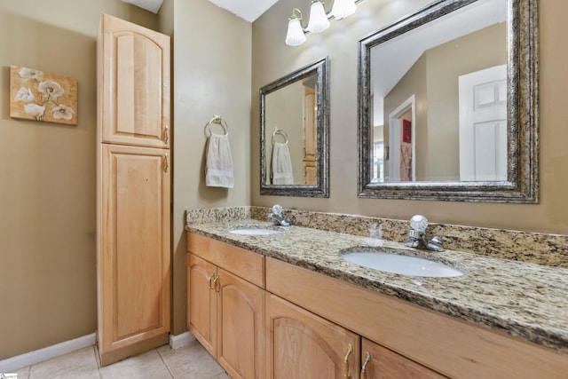 bathroom with tile patterned flooring and vanity