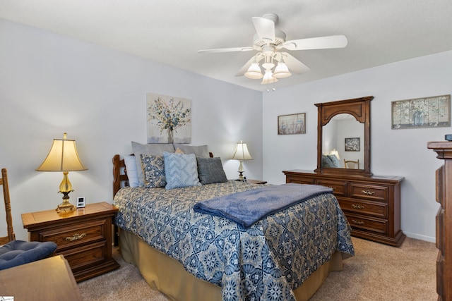 bedroom featuring light colored carpet and ceiling fan