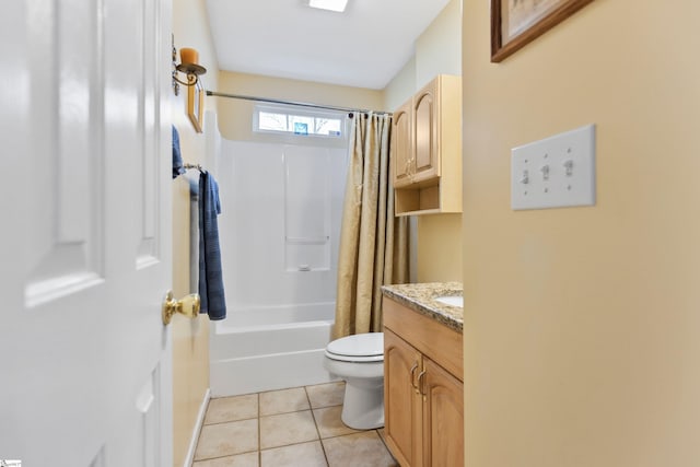 full bathroom featuring tile patterned flooring, vanity, toilet, and shower / bath combo with shower curtain