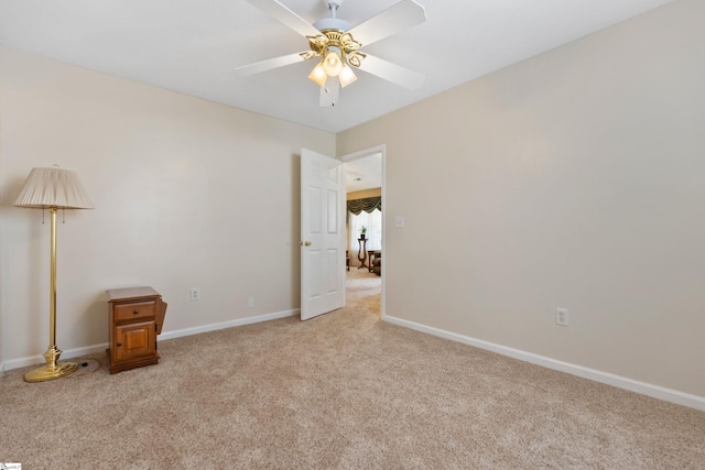 unfurnished bedroom featuring light colored carpet and ceiling fan