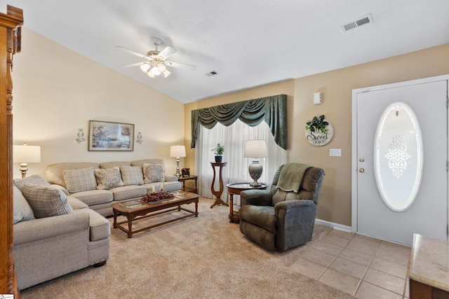 living room featuring light tile patterned flooring, ceiling fan, and lofted ceiling