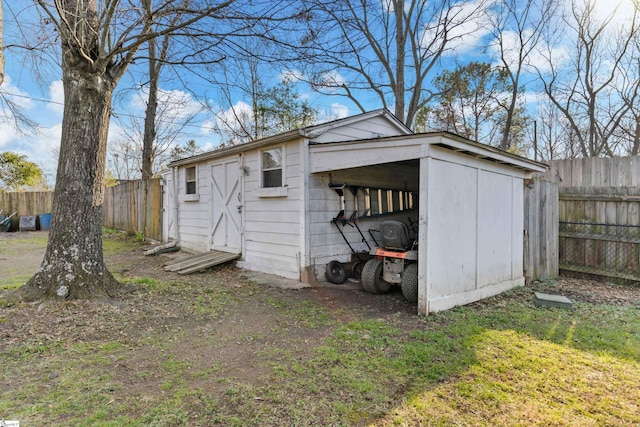 view of outbuilding featuring a yard