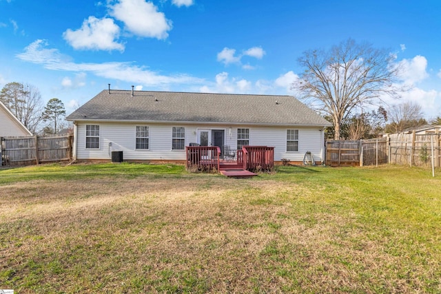 rear view of property with a wooden deck, a yard, and cooling unit