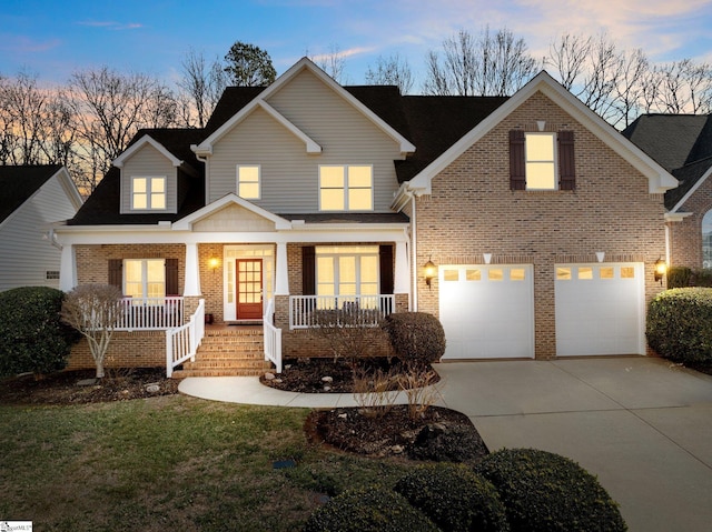 view of front of home with a garage and covered porch