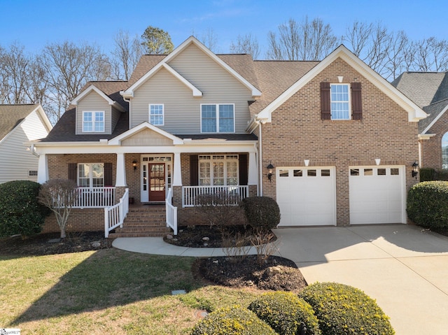 view of front of house with a garage and a porch