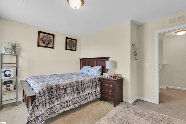 bedroom featuring light carpet