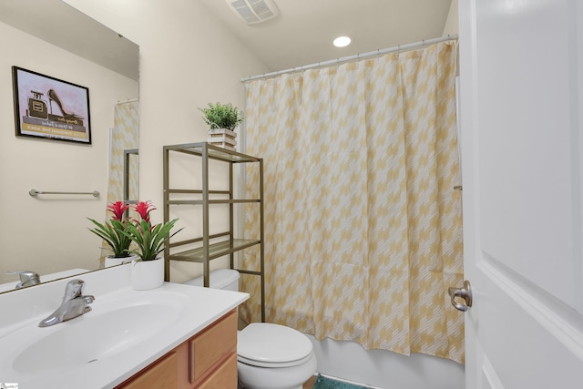 full bathroom featuring shower / bathtub combination with curtain, vanity, and toilet