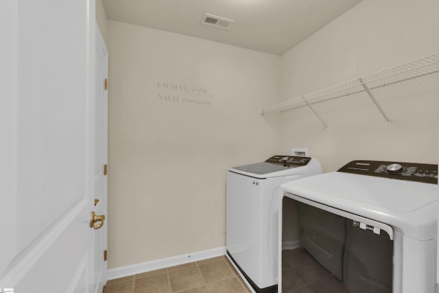 laundry area with washer and clothes dryer