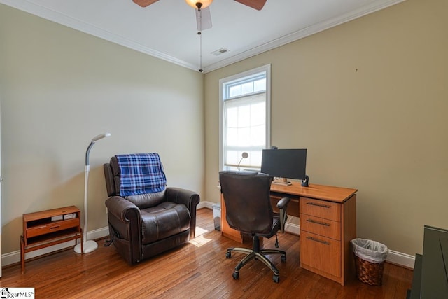 office area featuring ornamental molding, ceiling fan, and light wood-type flooring