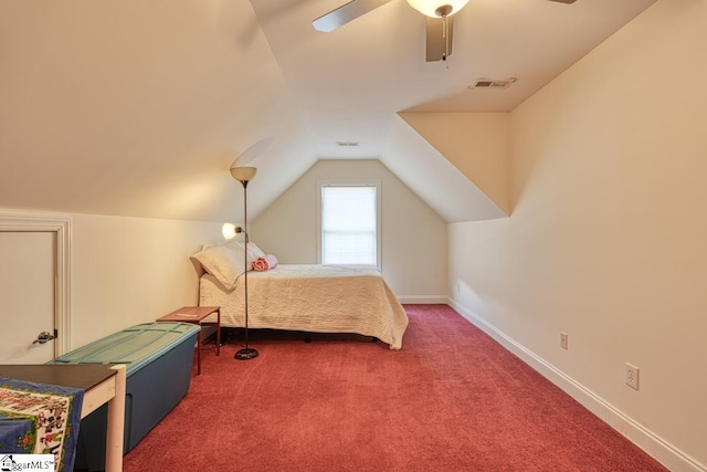 bedroom featuring dark carpet, vaulted ceiling, and ceiling fan