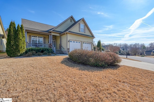 view of front of house featuring a garage and covered porch