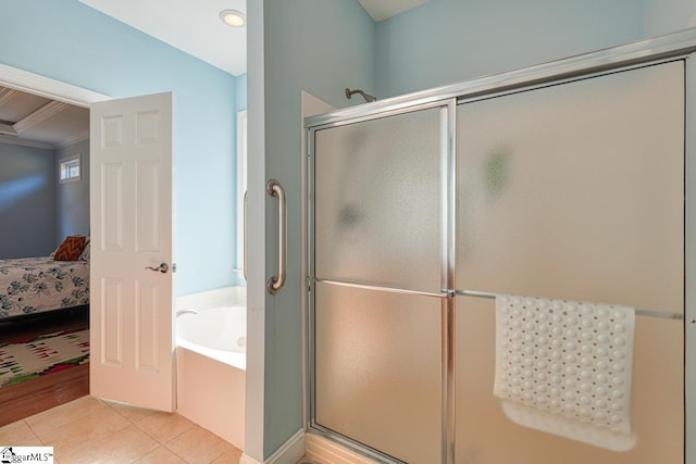 bathroom with crown molding, tile patterned floors, and independent shower and bath