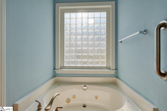 bathroom featuring a tub to relax in