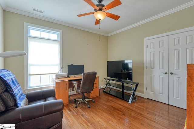 office area with crown molding, ceiling fan, and light hardwood / wood-style floors